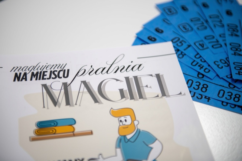 Ulotka pralni Magiel i niebieskie numerki odbioru
